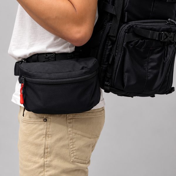 Fanny pack worn on the waist strap with the backpack